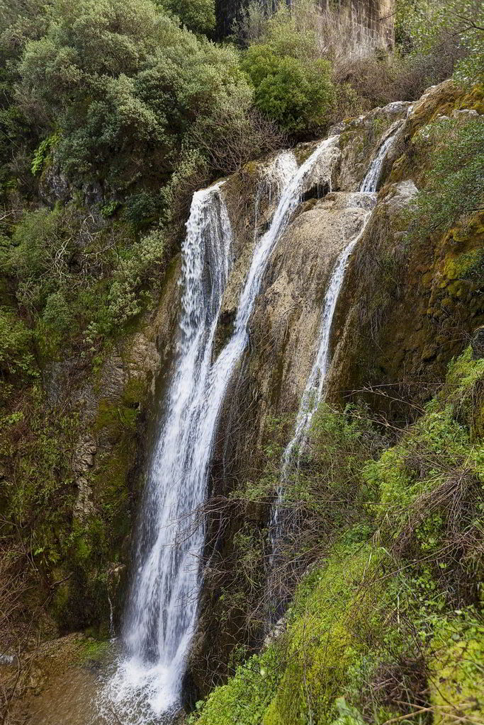 The waterfalls of Nimphes. At Nimphes, a beautiful village with lush vegetation located at an altitude of 200m, you will find the waterfalls where according to Greek Mythology the Nymphs used to bathe. You will admire the big, almost ten meters high, waterfall and another one nearby. The area is dominated by the green colour of the vegetation and the sound of the falling water will offer you serenity and accompany you throughout your visit to this unique place. It is an ideal place to explore for all hikers and nature enthusiasts.